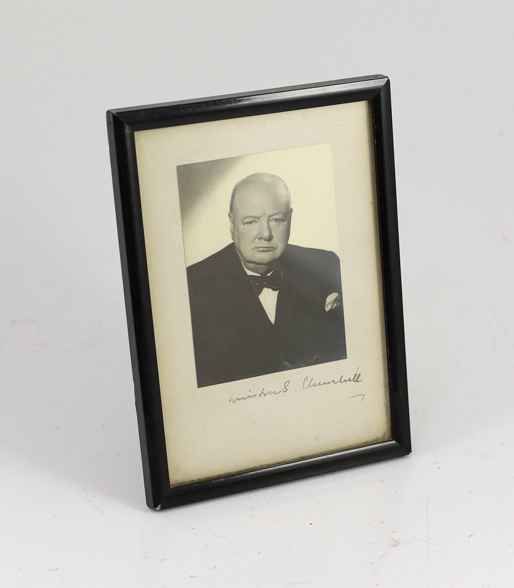 A signed black and white photograph of Winston Churchill by Vivienne, overall 19 x 14cm